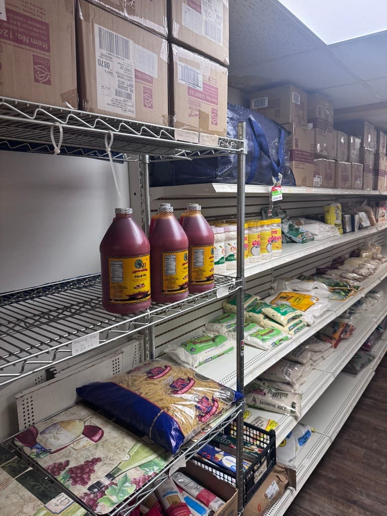 Shelves of palm oil and bags of rice at the Morgantown African store