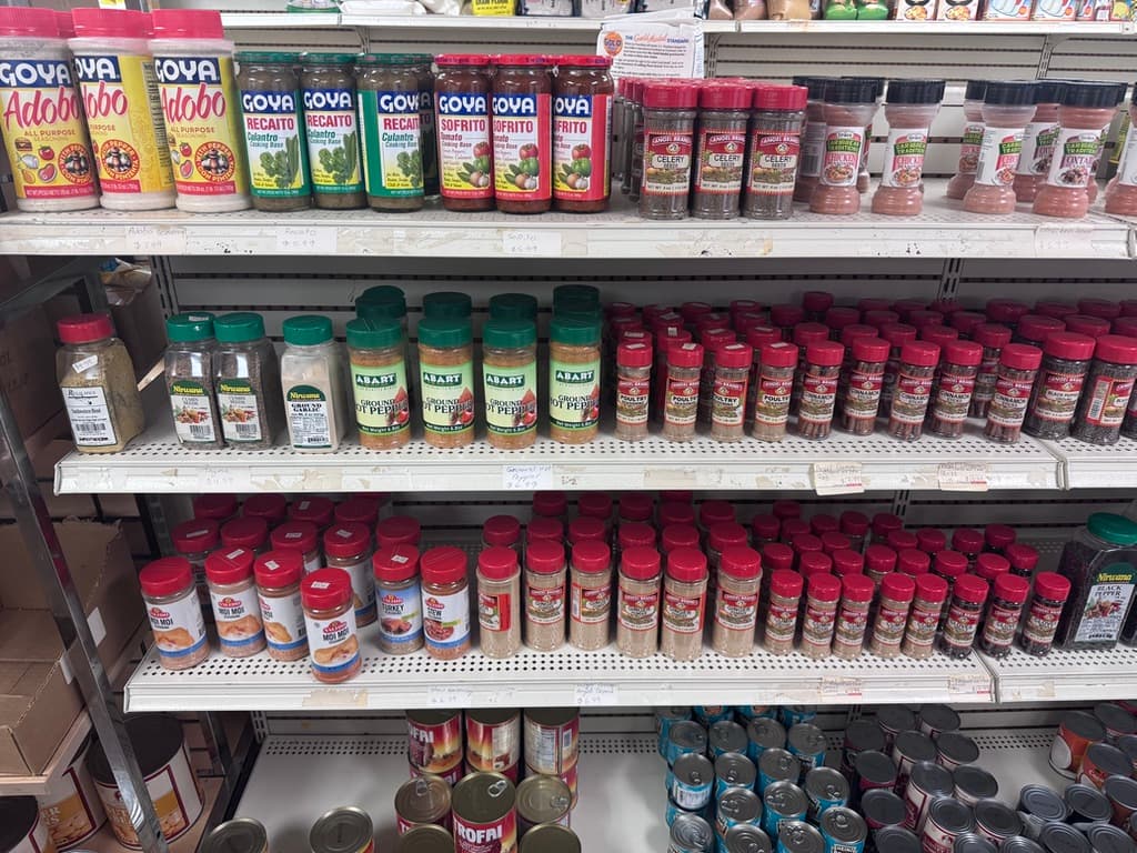 Goya sofrito, adobo and seasoning shelf at the food market