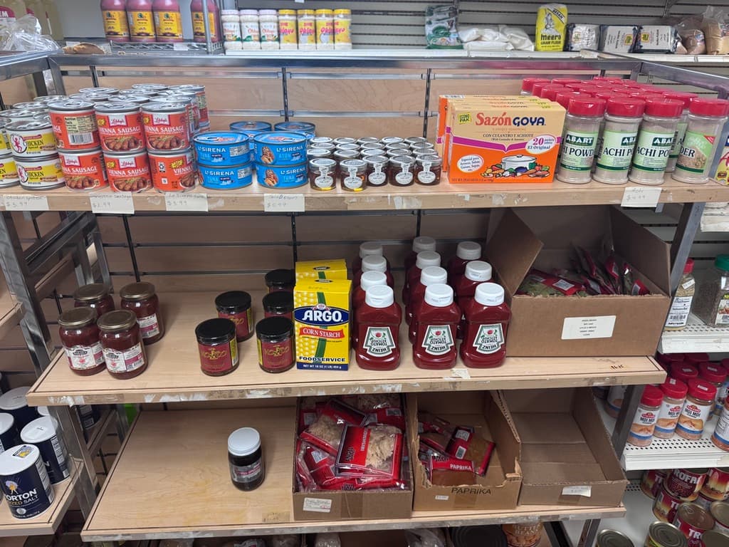 Well-stocked grocery aisle with freezer at the Morgantown African market